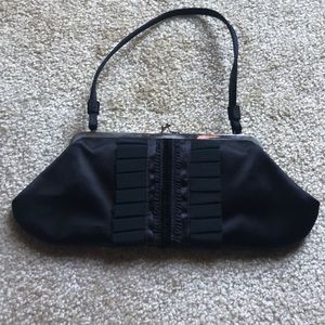 Vintage Anya Hindmarch vintage satin and grosgrain shoulder bag. It’s so awesome